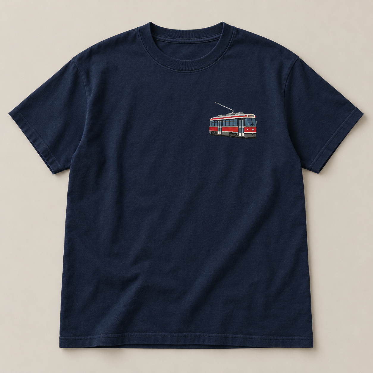 Navy T-shirt with a red and cream pixel Toronto streetcar chest graphic